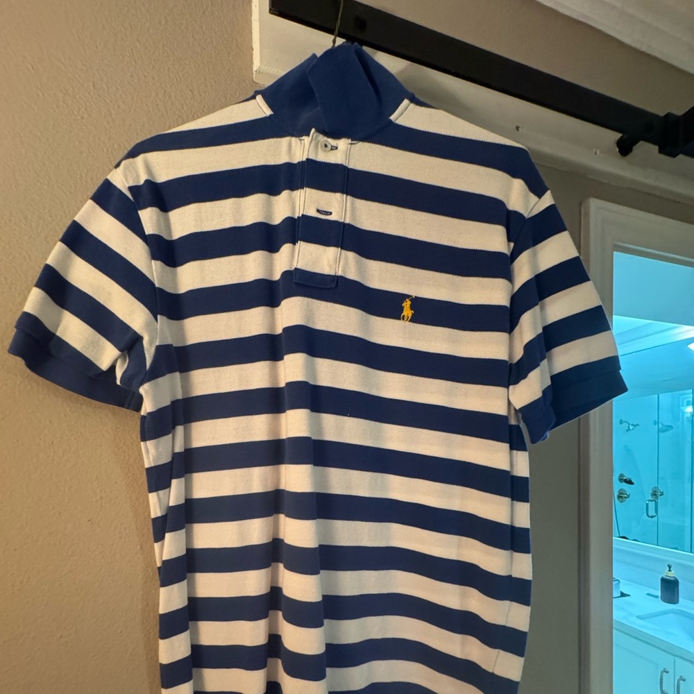 Blue with white strips polo. Excellent condition